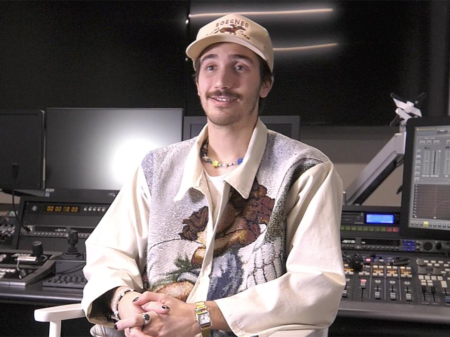 Noah Riffe seated in a TV studio